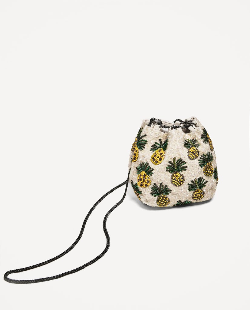 "I am headed to Coachella in a few weeks and need a cute bag to hold all my essentials. Through my search, I found this whimsical option from Zara ($50) that looks like it would do the trick. How can you not love the pineapple print?" — ML