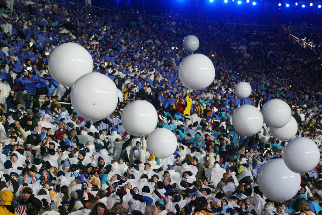 There were a whole bunch of white balloons in the crowd.