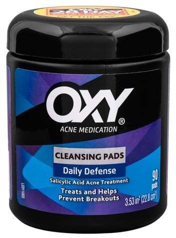 After cleansing, I exfoliate with salicylic acid, which is the best acid for acne prone skin. Salicylic is a BHA, so it penetrates the skin's surface and clears the inside of the pores. These Oxy 90ct Daily Defense Cleansing Pads ($4) are perfect for treating clogged pores and obviously, acne.