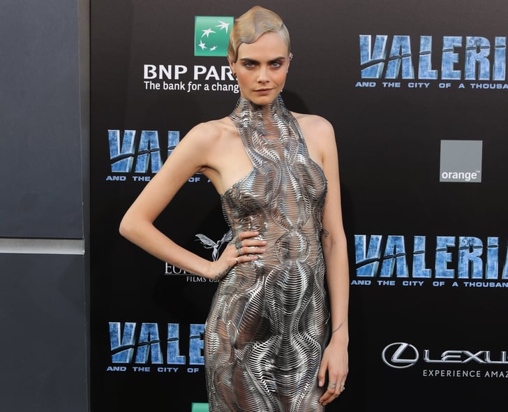 Cara Delevingne appears to wear nothing but aT-shirt as she tries