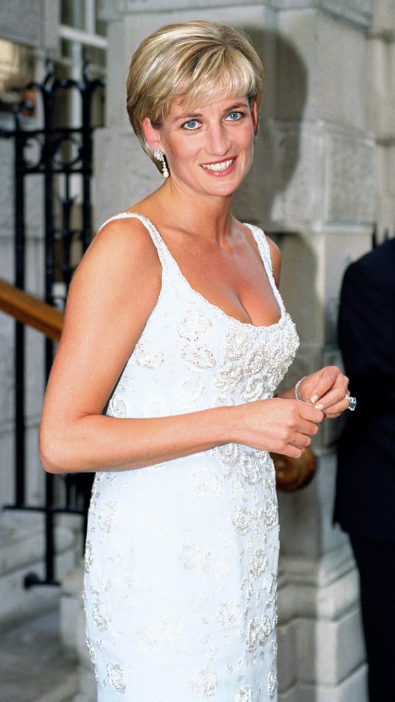 Diana looks stunning with mauve lip gloss and crisp white nail polish.