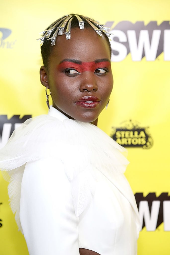 Lupita Nyong’o’s Exposed Alligator Pins in 2019