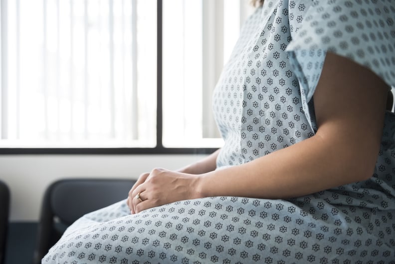 d and c procedure, woman sitting in hospital gown