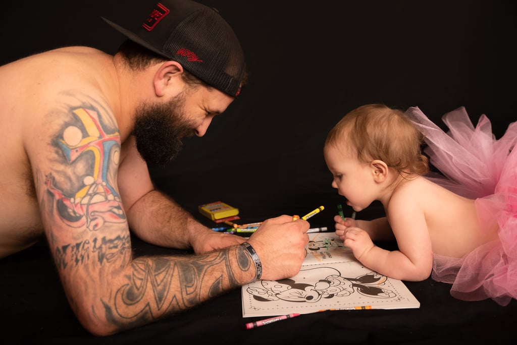 Dad and Baby Daughter Wear Matching Tutus For Photo Shoot