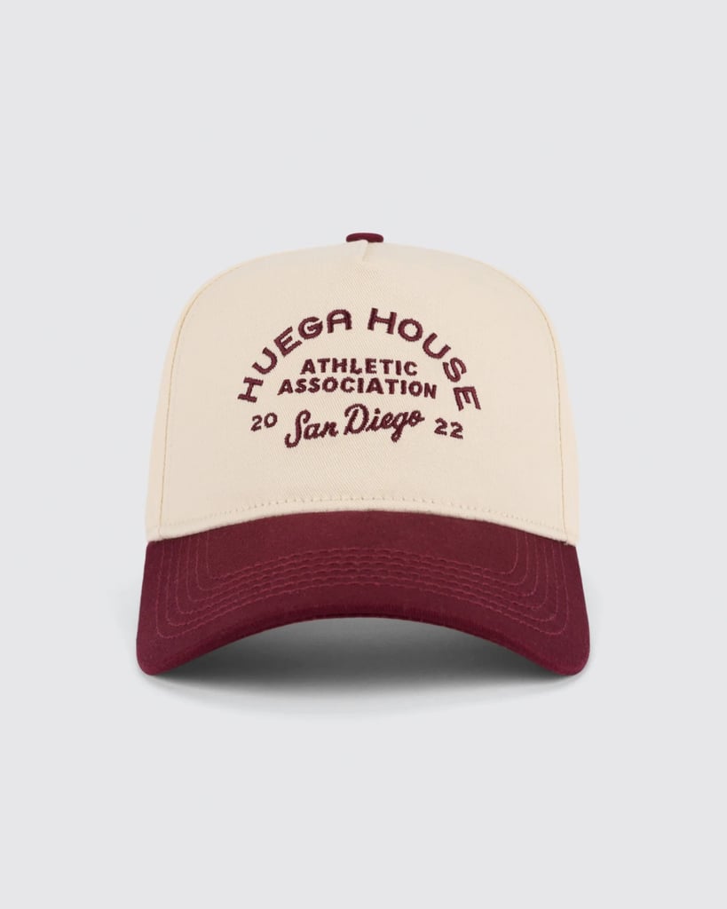 Huega House Athletic Association Hat ($39)
I wear this hat so much that, at this point, I need a new one. Not only do I wear it all the time — flights, shopping, you name it — but it also doubles as decor in my bedroom, giving it that effortless, thrown-together beachy vibe (even though, admittedly, I put a lot of effort into making it look effortless). I love the colors, and if the person in your life also loves a good trucker hat, this is definitely worth putting on their radar.