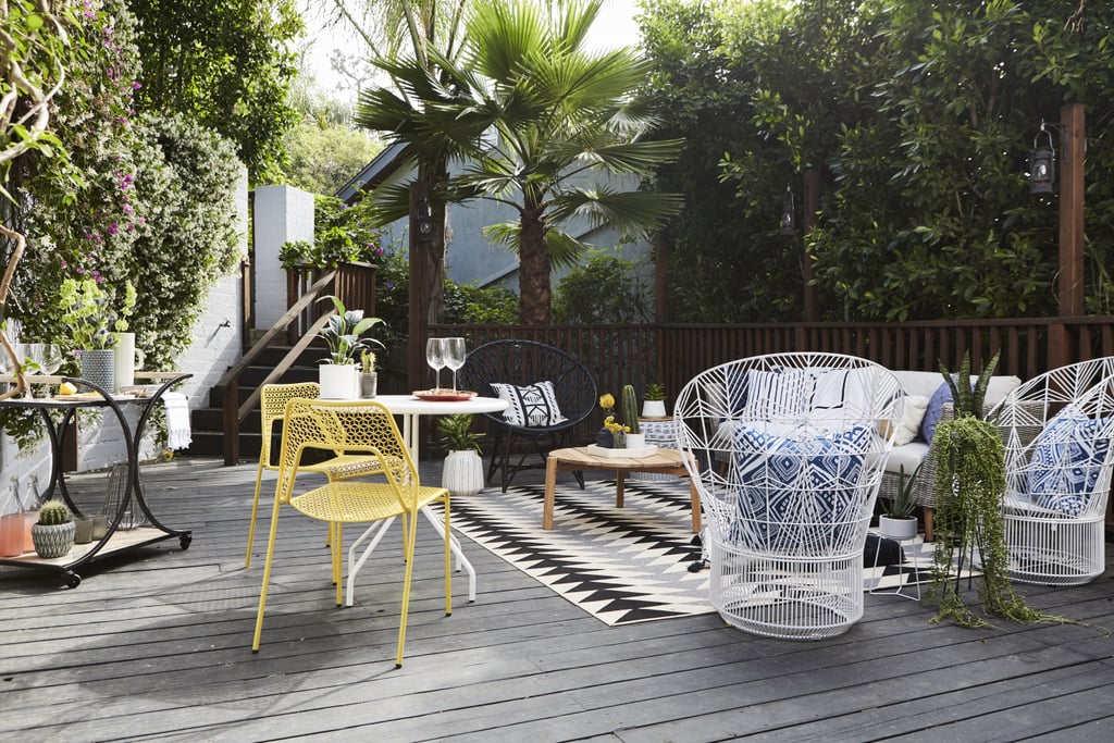 Wanting to avoid anything clunky, while still decorating with the comfortable pieces her husband Bryan loves, Jamie went with a mix of metal, rattan, and wicker furniture. It's inviting while being able to stand up to the elements.