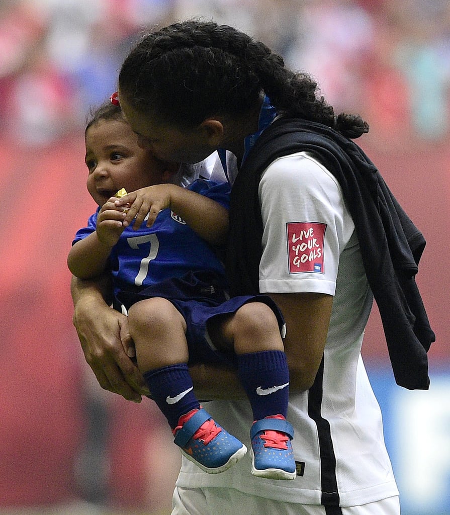 Shannon Boxx snuggled her daughter, Zoe, 16 months, right after the big win.