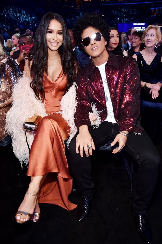 Bruno Mars has been dating model and actress Jessica Caban since 2011, but the two have only made a handful of high-profile appearances together. But at Sunday night, we got to see a glimpse of their chemistry at the 60th annual Grammy Awards, where Bruno took home three trophies and also hit the stage to perform "Finesse" with Cardi B. Fun fact: Bruno and Jessica have only made public appearances together at the Grammys: first in 2014, then in 2016, and now in 2018. Keep reading to see photos from their night.