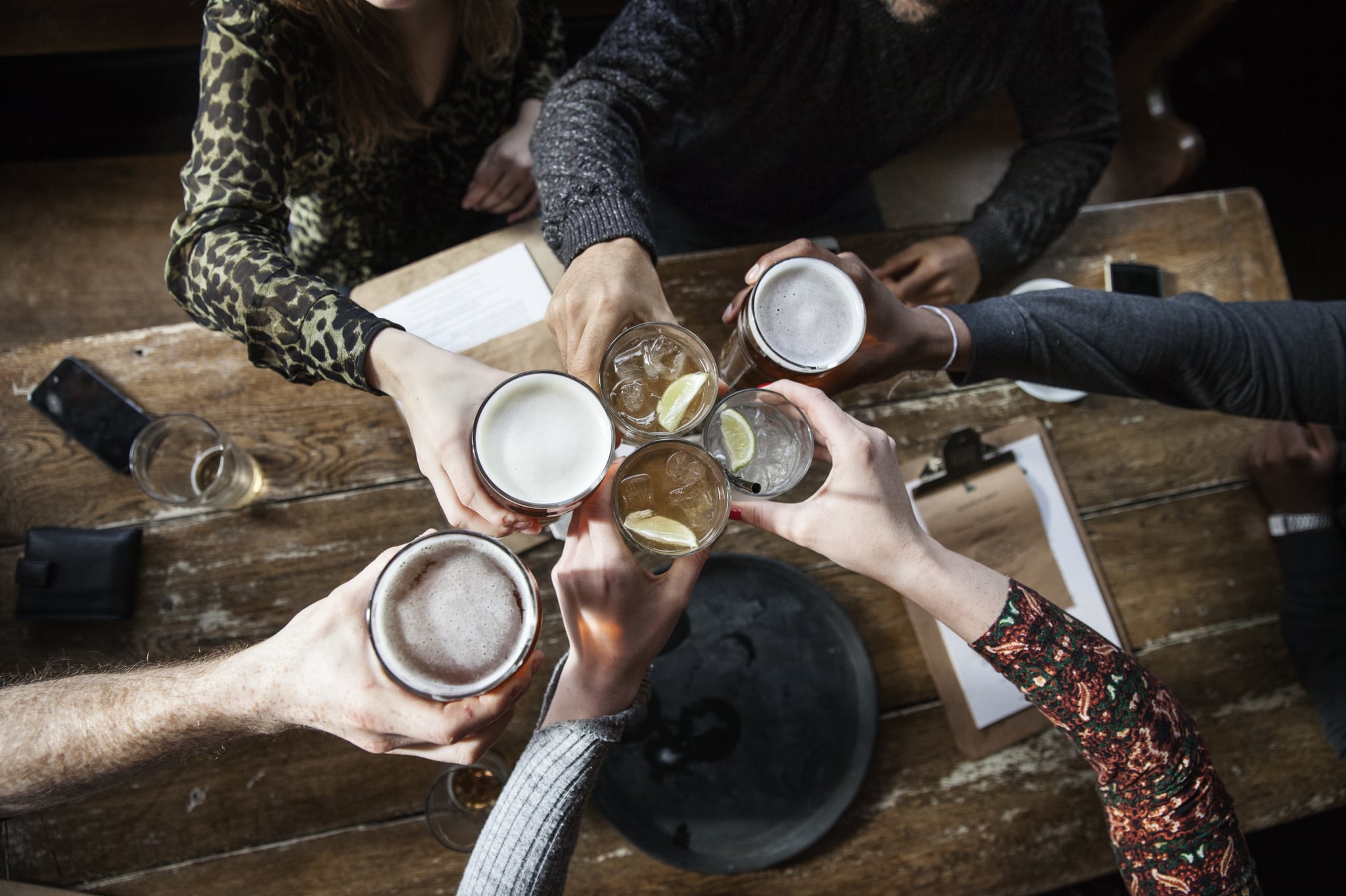 friends at a pub toasting, having a good time, birds view