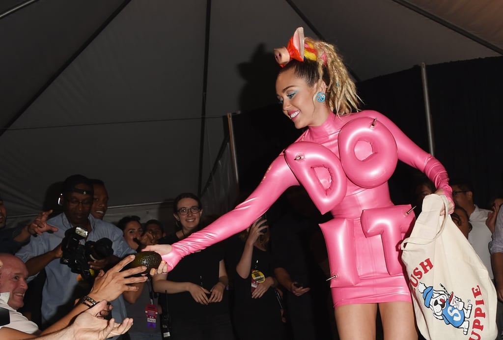 Miley Cyrus Shares a Joint With Photographers at VMAs