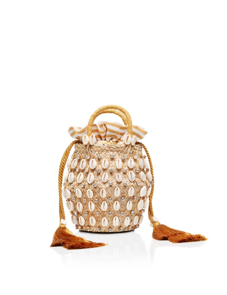 "I'm obsessed with both straw bags and the seashell trend, so this Aquazurra x Le Ninè Riviera Mini ($795) from the brand's High Summer capsule collection is my seasonal accessory splurge. I'll use it on weekends, with wedding guest dresses, and ,of course, on holiday. — LL