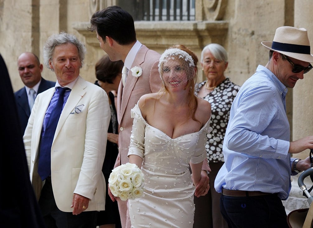 He was decked out in a red and white seersucker suit for the ceremony, while Josephine's dress was made by pal Zac Posen.