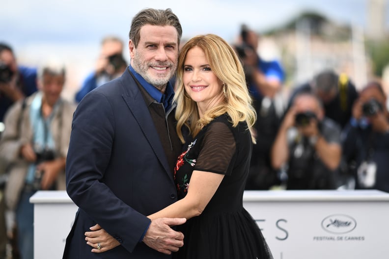 TOPSHOT - US actor John Travolta (L) and his wife US actress Kelly Preston pose on May 15, 2018 during a photocall for the film 