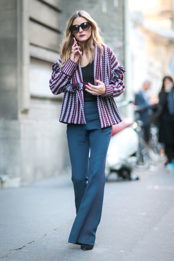 Olivia channeled a boho vibe in flared pants and a knit cardigan ...