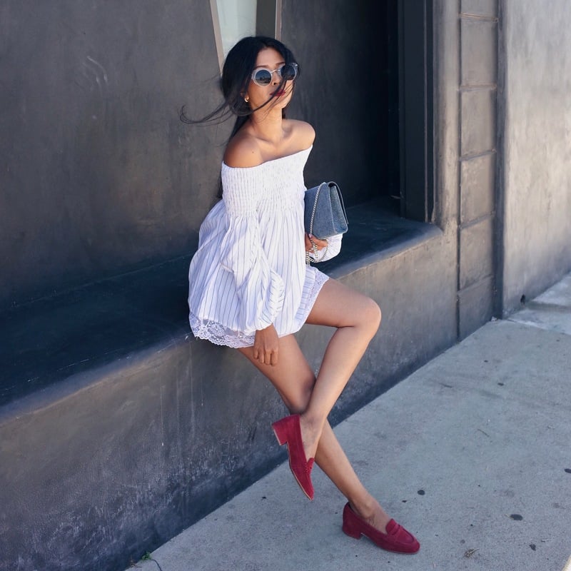 A smocked off-the-shoulder bell-sleeve tunic with denim shorts and block heels.