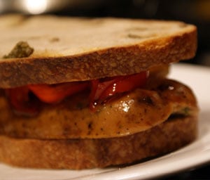 Grilled Gourmet Sausage Sandwich on Olive Bread Grilled Gourmet Sausage Sandwich on Olive Bread