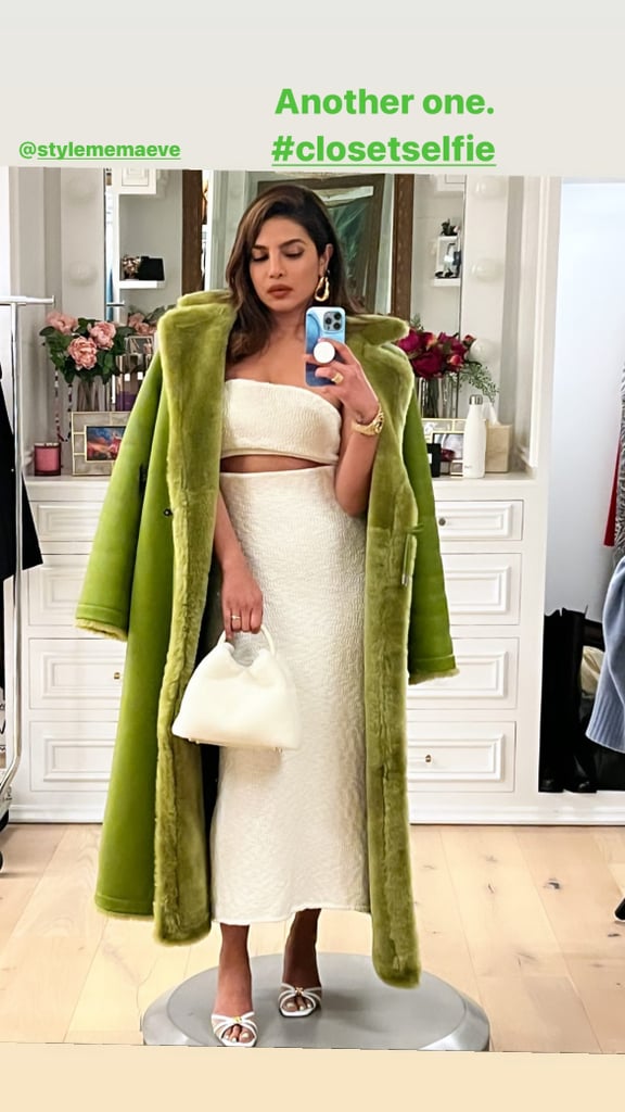 Priyanka Chopra has been stepping out in a series of colorful outfits, both for industry events and high-fashion editorials alike. The 40-year-old mom of one most recently posed for a closet mirror selfie that she posted on her Instagram Stories, sporting yet another vibrant ensemble. Styled by Maeve Reilly, Chopra was wearing a knit cutout dress by Camilla and Marc that gave off the illusion of a two-piece set. The all-white number is made from a comfortable stretch cotton and features a splice underneath the bust and a slit at the back for movement. With a green shearling Saks Potts coat perched on her shoulders, Chopra played up the textural theme with an Elleme Paris fuzzy top handle bag and Malone Souliers Perla mule sandals. The shoes are constructed from panels of mesh with gold stitching that complemented her chunky jewelry. Her hair was swept to the side in textured waves, and her beauty look included shimmering eyeshadow and a matte raspberry lip. While the sleeveless midi and open-toed shoes felt light, Chopra made her look winter appropriate by way of textured details. While making press rounds in London on Jan. 10, Chopra wore a plunging leather dress teamed with a midnight navy coat and Christian Louboutin suede boots. And one day later, she made an appearance in a whimsical golden-yellow gown featuring a thigh slit and satin trim. Ahead, shop every piece from Priyanka Chopra's latest look, from her midi dress to her shearling coat. Related: Priyanka Chopra Brings Back the "Rachel" Haircut