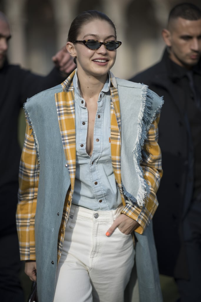 The model wore a denim blazer and ripped jeans by R13 over her denim button-down. She rocked a pair of Vogue Eyewear x Gigi Hadid sunglasses.