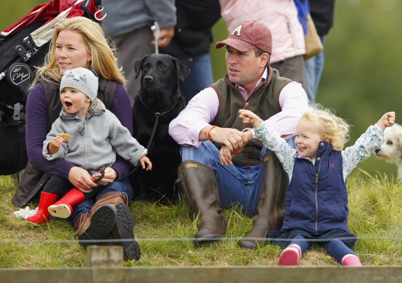 Peter, Autumn, Savannah, and Isla Phillips With the Family's Black Lab