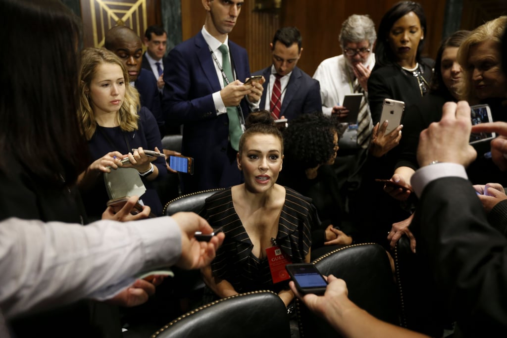 Alyssa Milano speaks to the press at the hearing.