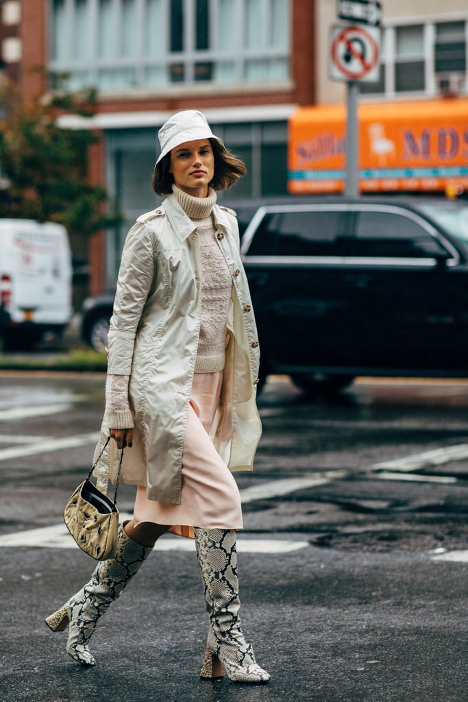 A neutral-colored bucket hat is just the icing on the cake when you're already sporting a multidimensional look consisting of snakeskin boots and an embellished purse.