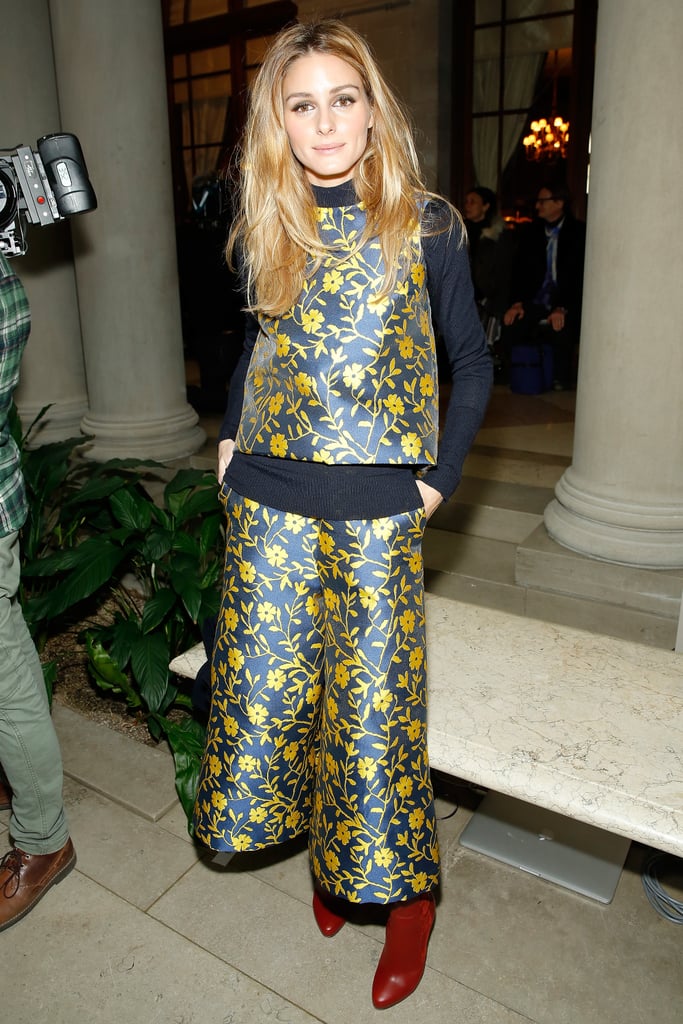 For Carolina Herrera, Olivia wore the designer head to toe, save for a pair of Christian Louboutin boots. For Carolina Herrera, Olivia wore the designer head to toe, save for a pair of Christian Louboutin boots.
