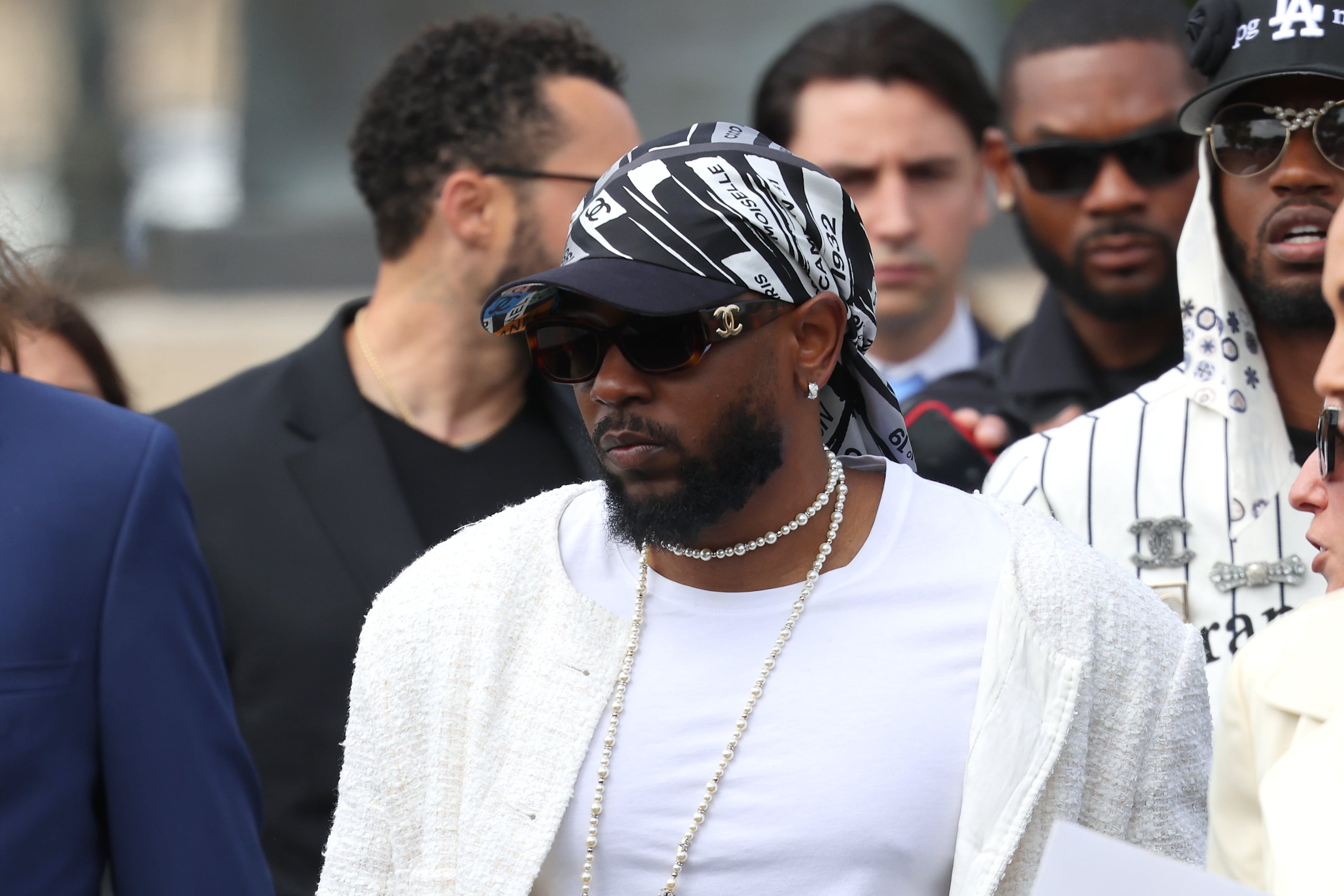 Kendrick Lamar with actress Lupita Nyong'o at Paris Fashion Week.