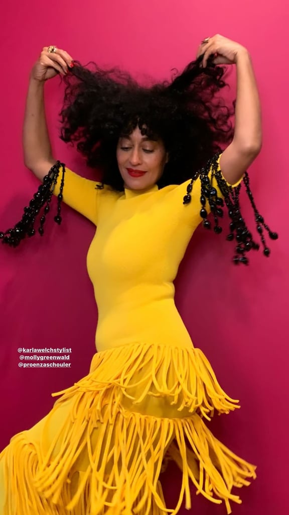 "When life gives you a fringe dress, you must twirl in it." — Tracee Ellis Ross, 2022.
OK, so Tracee didn't actually say this, but she certainly implied it with her latest style moment. For a Late Night With Seth Meyers interview on Thursday evening, the Black-ish star emulated pure sunshine in a yellow fringe dress, and although it was a virtual appearance from home, she still managed to show off the full look in all its glory. "I want to make an entrance like it's real. You're not gonna see my face, but the dress is so good, watch," she told Seth before standing up and doing a little shimmy to model the outfit.
Lucky for us, that wasn't the only peek at the knit dress that Tracee offered — she also posted a slow-motion video of her dancing in it to further demonstrate how beautifully the fringe pieces and beaded sleeve tassels move. Selected by stylist Karla Welch, the party dress hails from Proenza Schouler's spring 2022 collection — and yes, it's available to purchase online right now if you're itching to get your twirl on. Shop it ahead after watching Tracee break it down and model the designer piece like the queen she is.

    Related:

            
            
                                    
                            

            29 New Midi Dresses From Nordstrom So Good, They&apos;ll Be Out of Stock by April