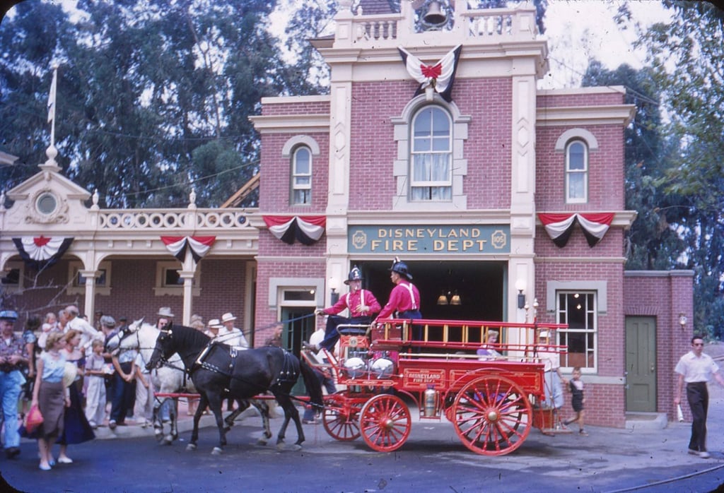 A horse-drawn carriage passed the Disneyland Fire Department building.