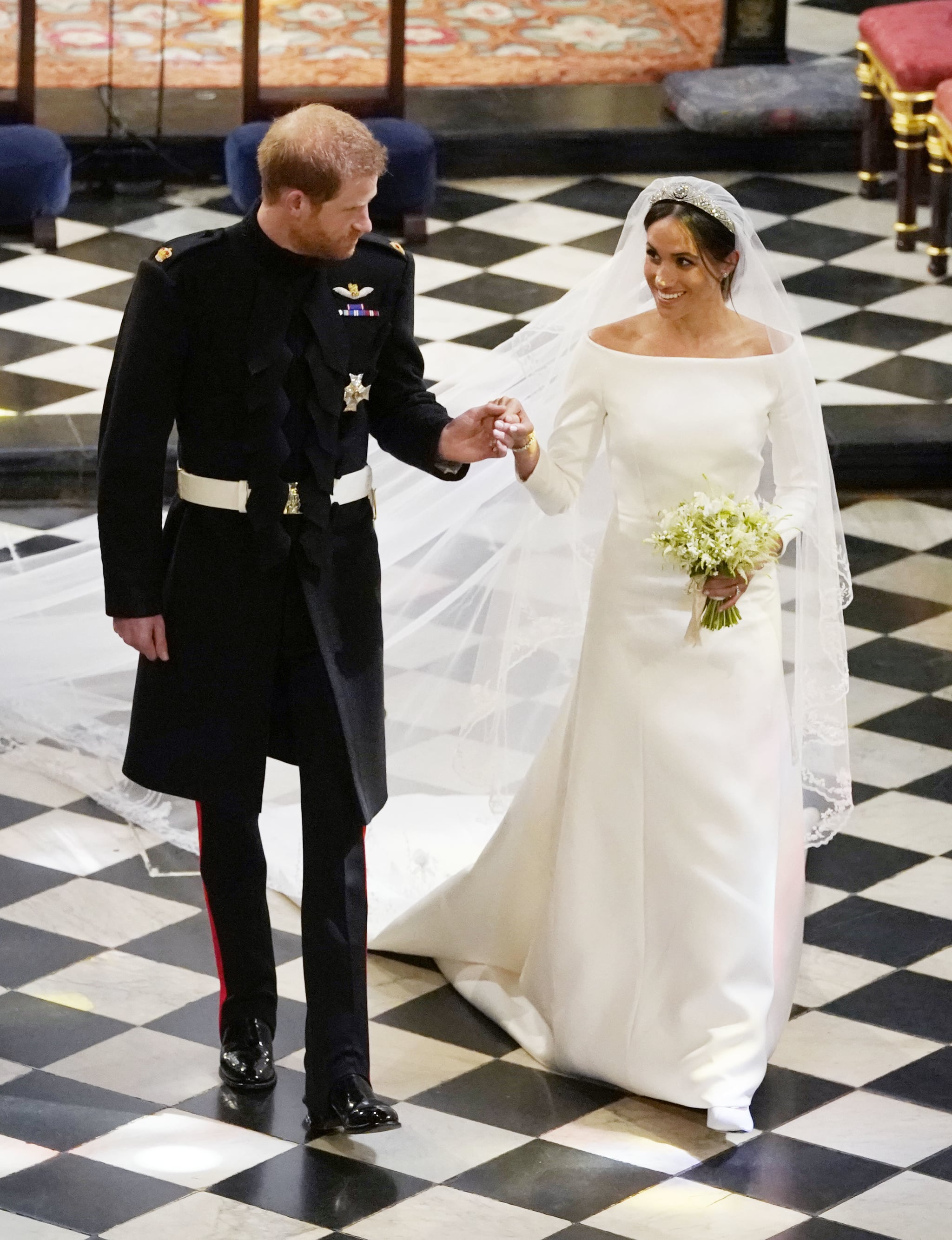 WINDSOR, UNITED KINGDOM - MAY 19:  Prince Harry, Duke of Sussex and The Duchess of Sussex depart following their wedding in St George's Chapel at Windsor Castle on May 19, 2018 in Windsor, England. (Photo by Owen Humphries - WPA Pool/Getty Images)