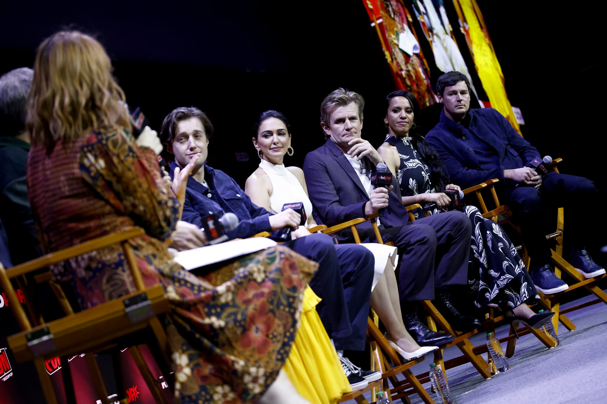 NEW YORK, NEW YORK - OCTOBER 07: (L-R) Felicia Day, Leon Wadham, Nazanin Boniadi, Charles Edwards, Sara Zwangobani and Benjamin Walker speak onstage at 'Prime Video Presents : The Lord of The Rings: The Rings of Power' panel during New York Comic Con 2022 on October 07, 2022 in New York City. (Photo by Paul Morigi/Getty Images for ReedPop)