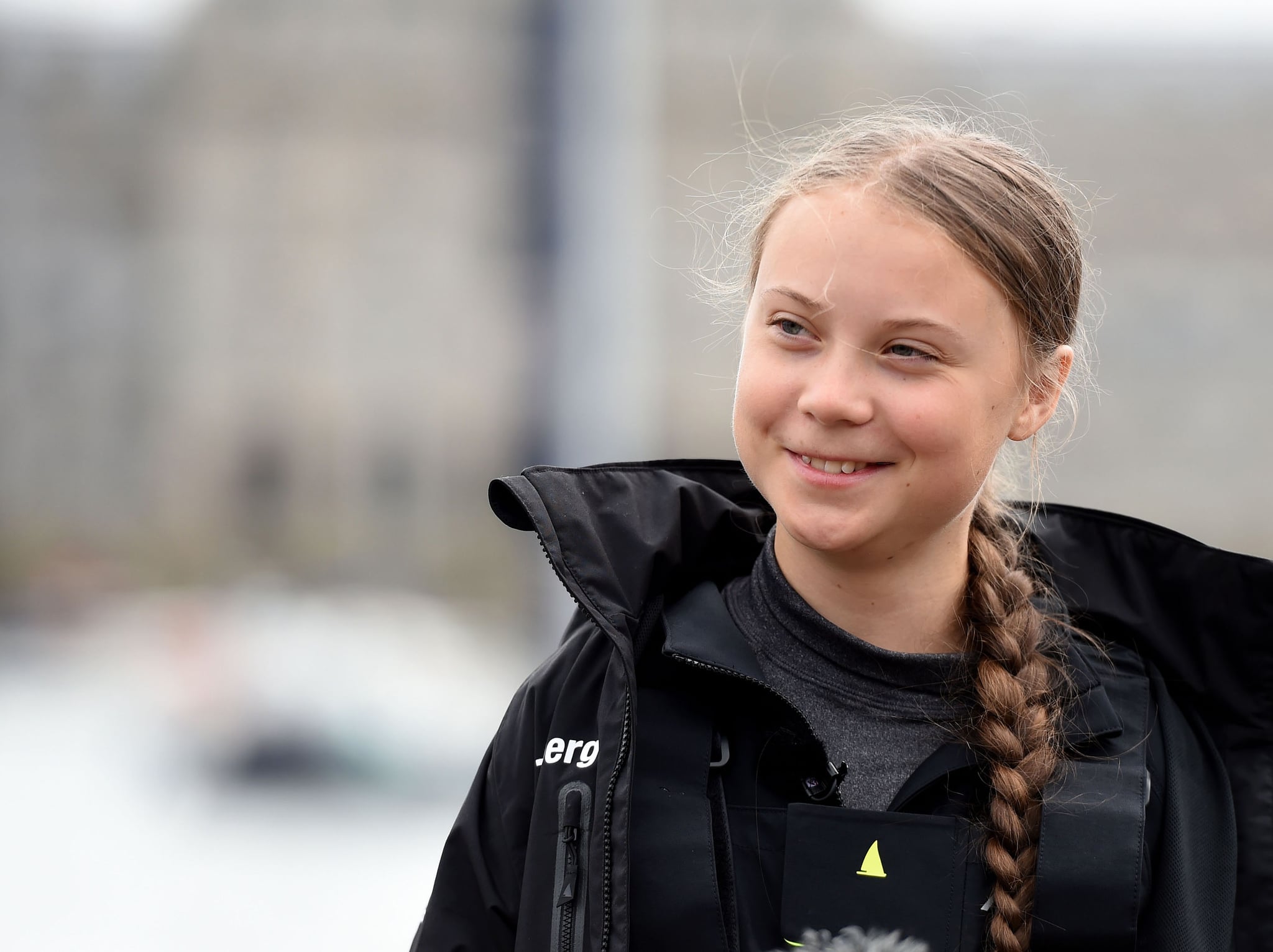 PLYMOUTH, ENGLAND - AUGUST 14: Climate change activist Greta Thunberg speaks at a press conference before setting sail for New York in the 60ft Malizia II yacht from Mayflower Marina, on August 14, 2019 in Plymouth, England. Greta Thunberg is a teenage activist born in Sweden in 2003. She began protesting outside the Belgian Parliament aged 15 and started the School Strike for Climate movement which has gained global popularity seeing school students campaigning against Climate Change on Fridays instead of attending their lessons. Greta has stopped flying as the aviation industry is responsible for 12% of CO2 emissions from all forms of  transports. Once in New York she will attend a climate change conference. (Photo by Finnbarr Webster/Getty Images)