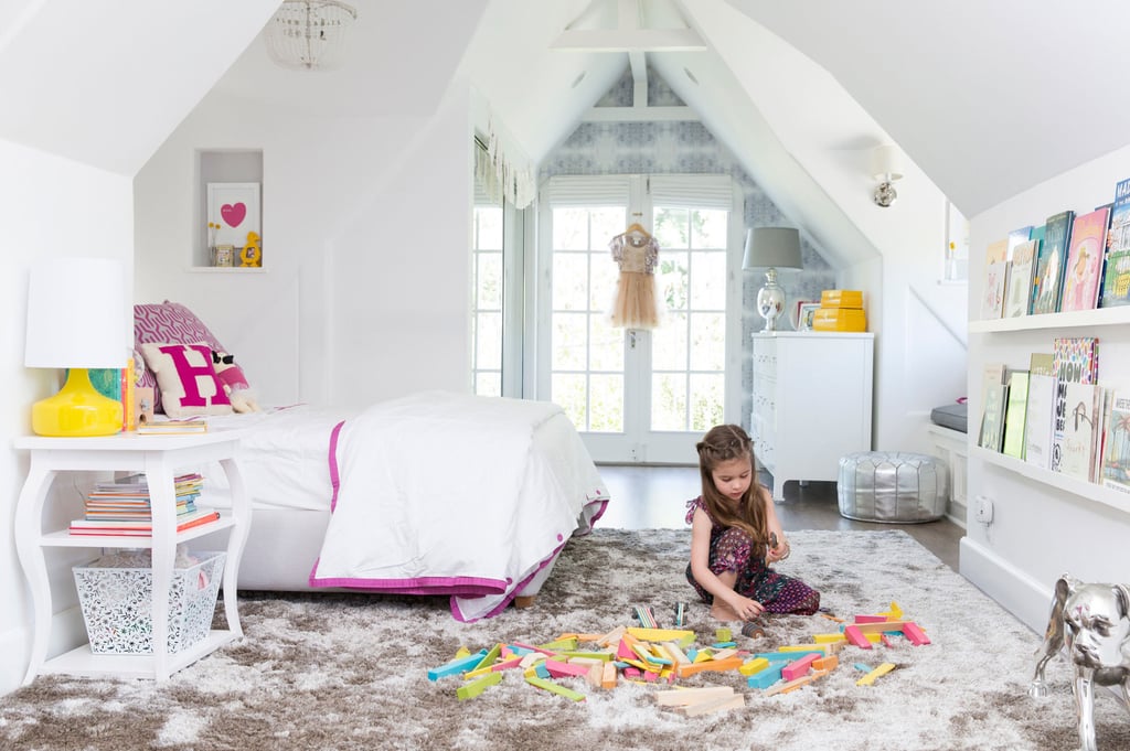 Five-year-old Harper's room is the perfect mix of girlish whimsy and functionality. Serena & Lily bedding, kaleidoscopic Eskayel wallpaper, and a darling window seat set the tone, while beloved books are only an arm's reach away.