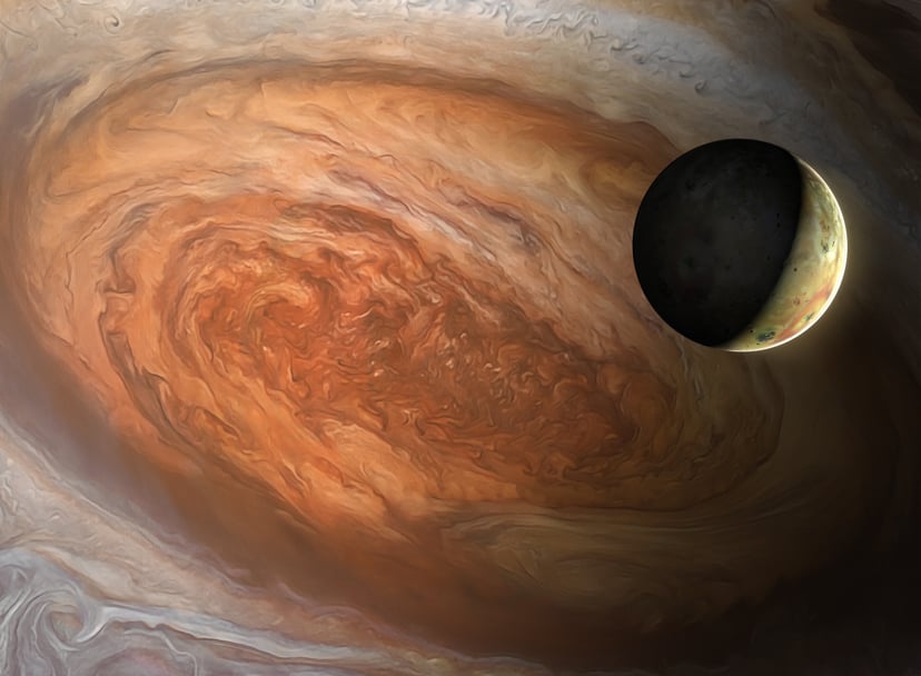 Illustration of the Jovian moon Io, seen against the backdrop of Jupiter's Great Red Spot. The latter is a vast, cyclonic storm - wider than the entire Earth - that has raged for centuries. Io, a highly volcanic world, is the innermost Galilean moon of Ju
