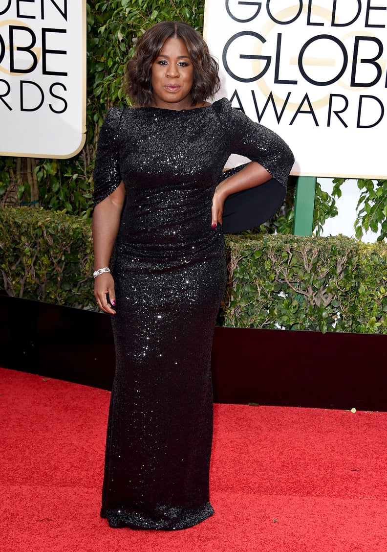 Uzo Aduba in a black gown with cape-back details