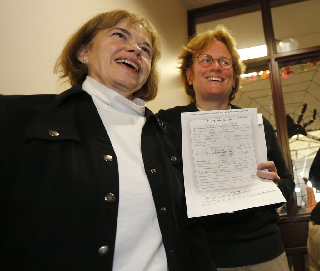 Suzanne Marelius and Kelli Frame were all smiles after getting their marriage license in Salt Lake City.