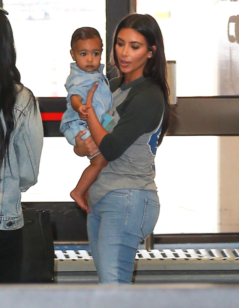 Kim Kardashian Carrying North West in LAX | Photos
