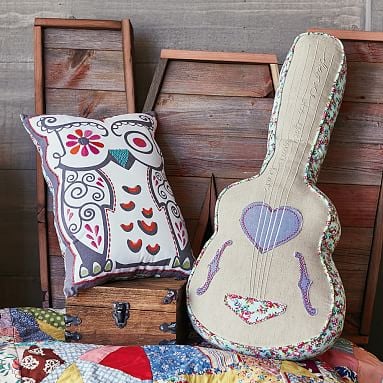 guitar-shaped statement pillow