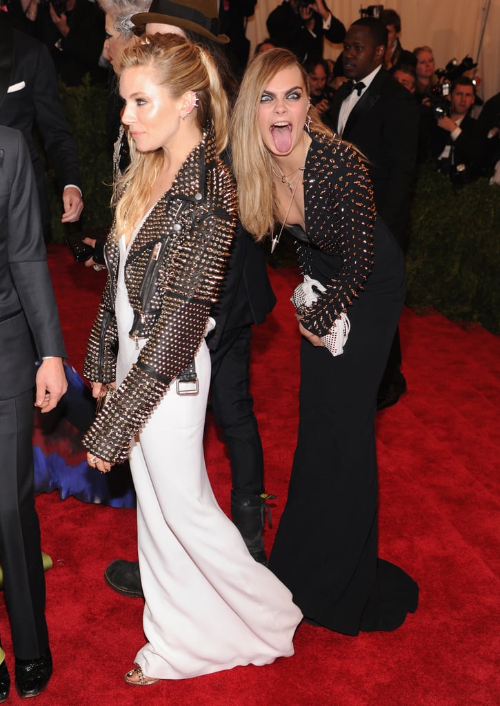 Cara Delevingne photobombed friend Sienna Miller in 2013.