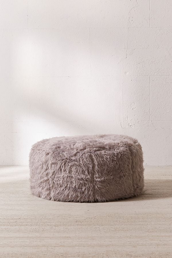 If You're Really in the Mood to #TreatYourself, You Can Get This Fuzzy Ottoman as Well