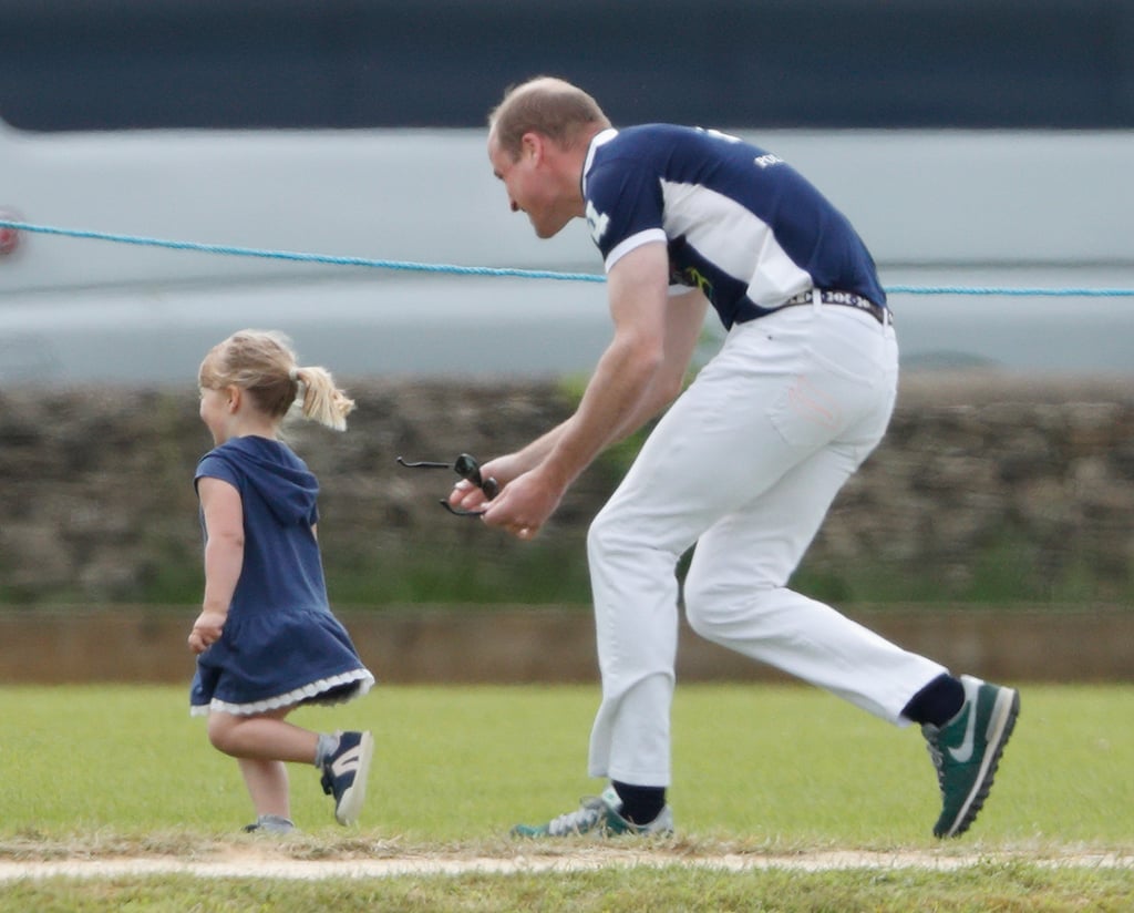 Prince William had an adorable encounter with his younger cousin, Mia, when he attended the annual Gloucester Festival of Polo in Tetbury, England, on Sunday. During the charity event, the father of Prince George and Princess Charlotte got in another workout as he chased the 3-year-old, who is Queen Elizabeth II's great-granddaughter, around in the grass. William even shared a sweet moment with her parents Zara and Mike Tindall as the three greeted each other with warm hugs. 
This isn't the only time William was spotted horsing around this week. On Saturday, the royal braved the London heat as he attended The Colonel's Review, a military rehearsal for the queen's birthday parade (also known as Trooping the Colour). Seeing that the past two parades have marked Prince George and Princess Charlotte's Buckingham Palace balcony debuts, we can't wait to see what the royal family does this year. 

    Related:

            
            
                                    
                            

            9 Ways Prince William Is Keeping His Mother&apos;s Memory Alive Within His Own Family