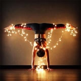 What's More Dazzling Than a Decorated Tree? Women Doing Yoga Wrapped in Twinkle Lights