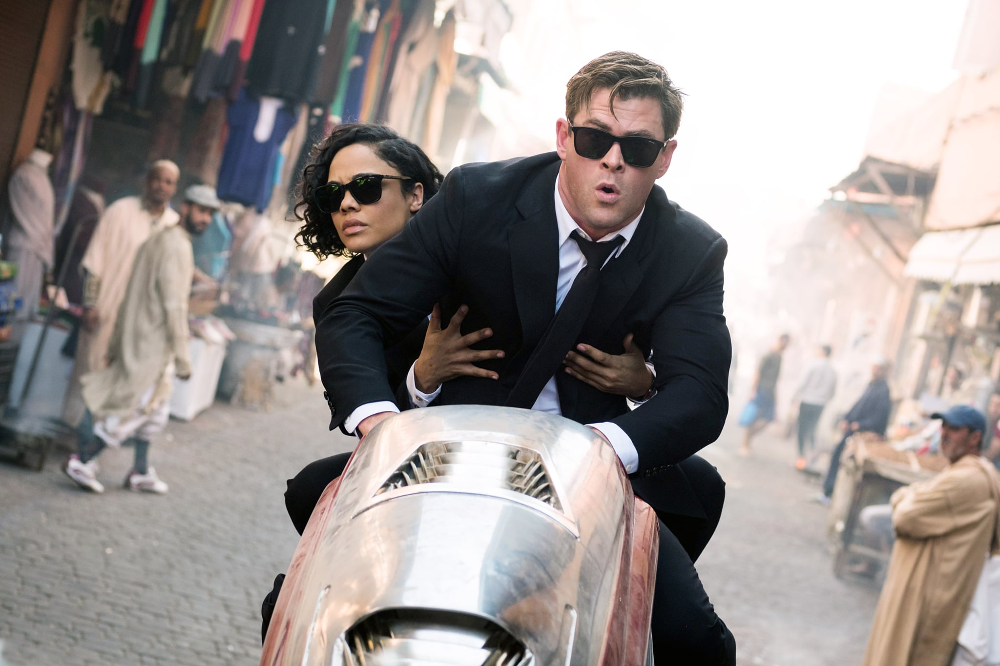 MEN IN BLACK: INTERNATIONAL, (aka MIB: INTERNATIONAL), from left: Tessa Thompson, Chris Hemsworth, 2019. ph: Giles Keyte /  Columbia Pictures / courtesy Everett Collection