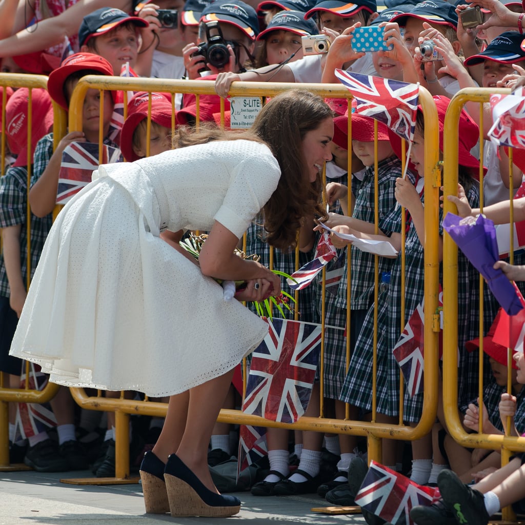 Even though she was separated by gates, Kate still made an effort to greet her small fans during a stop in Singapore in September 2012.