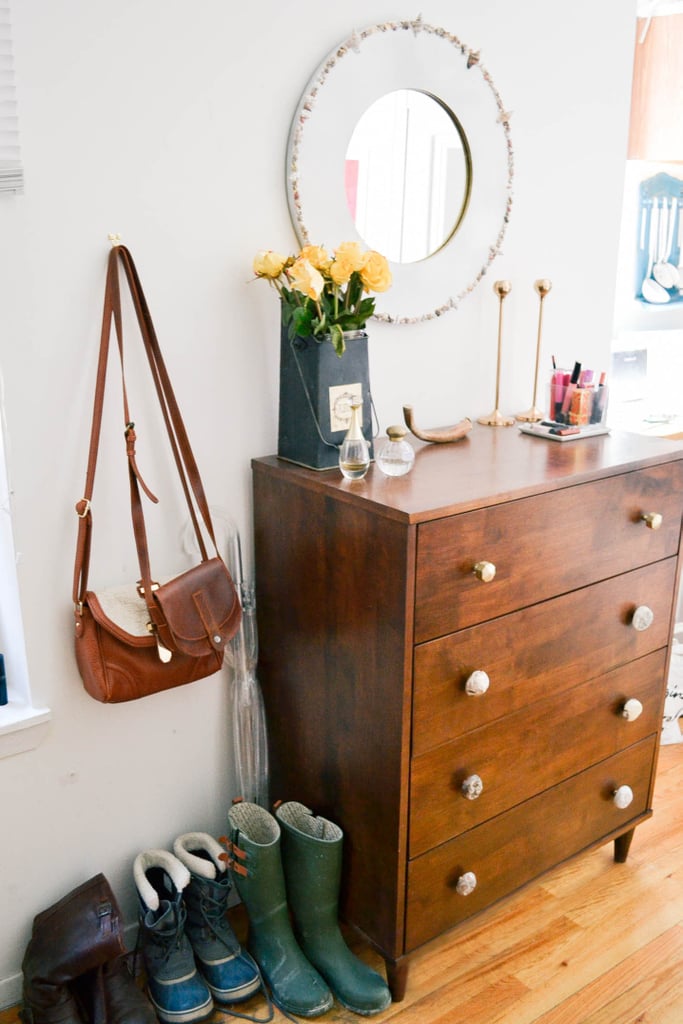Can't fit a dresser? Try putting it in the entryway, and let it double as an entry table. Maximizing your furniture's functions is a great way to save space in a small apartment.