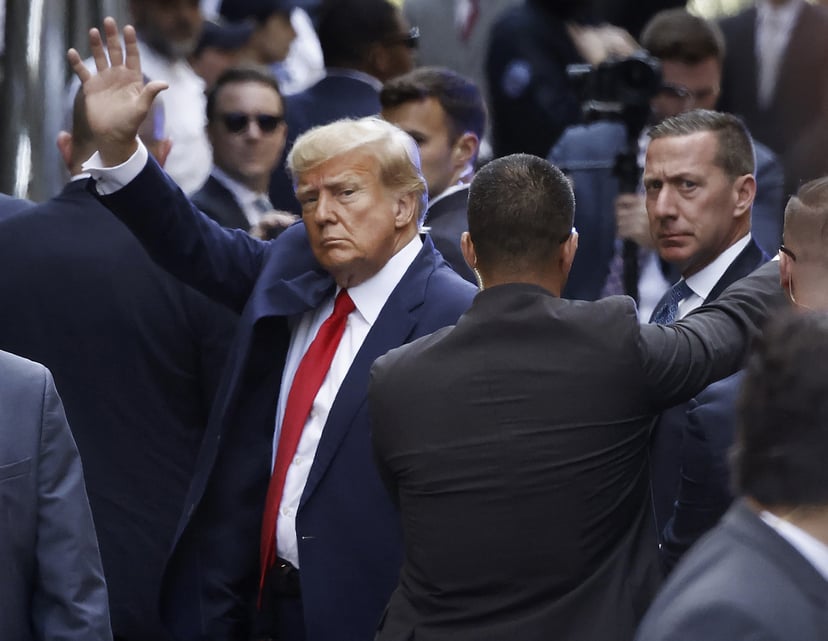 NEW YORK, NEW YORK - APRIL 04: (EDITOR'S NOTE: Alternate crop) Former U.S. President Donald Trump waves as he arrives at the Manhattan Criminal Court for his arraignment hearing on April 04, 2023 in New York, New York. Trump will be arraigned during his f