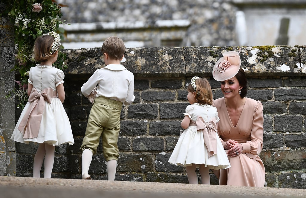 Kate looked on at George and Charlotte, both looking dapper and elegant at Pippa's wedding.