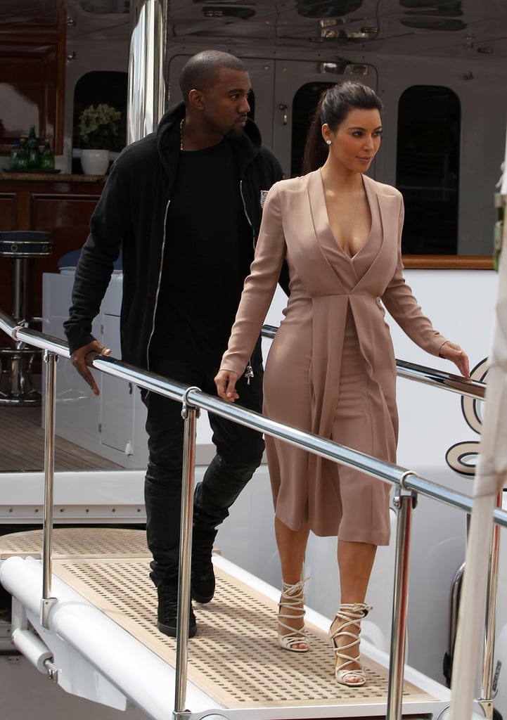 When they disembarked a yacht at Cannes, Kim was dressed to the nines ...
