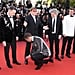 Taron Egerton Tying Elton John's Shoe Cannes Film Festival