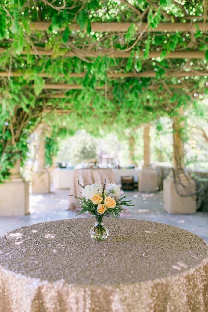 Pick floral arrangements that complement gold tablecloths.